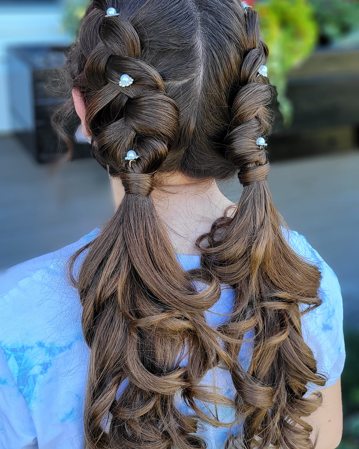 brown hair braided  and curled