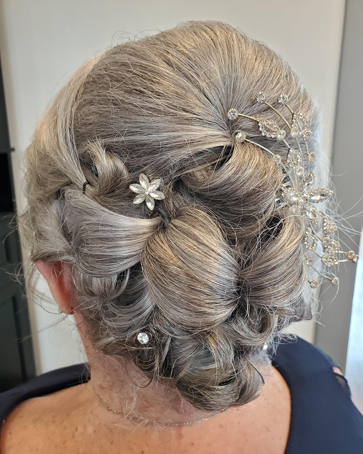 Elegant updo with floral hair accessories