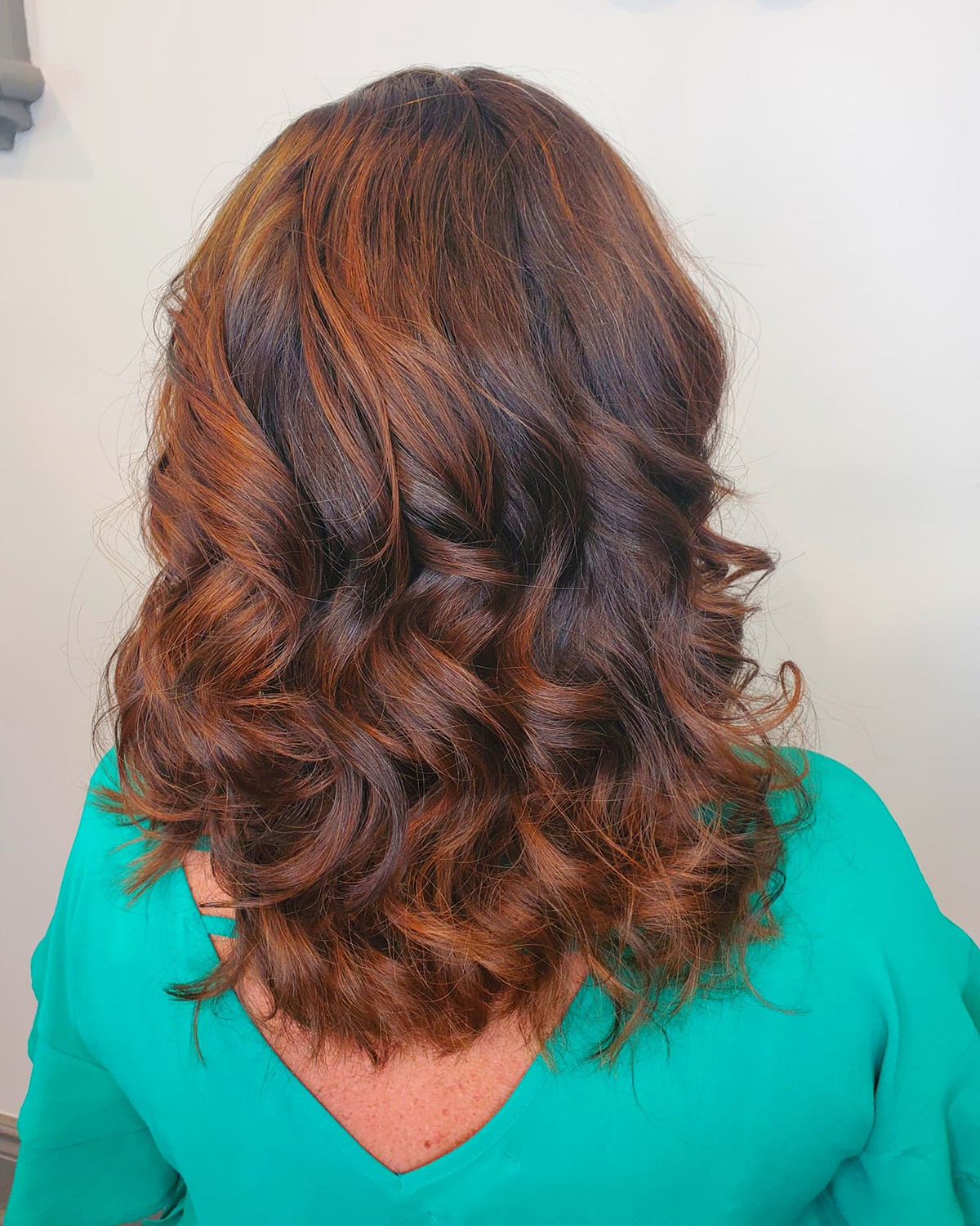 Woman with copper curly hair