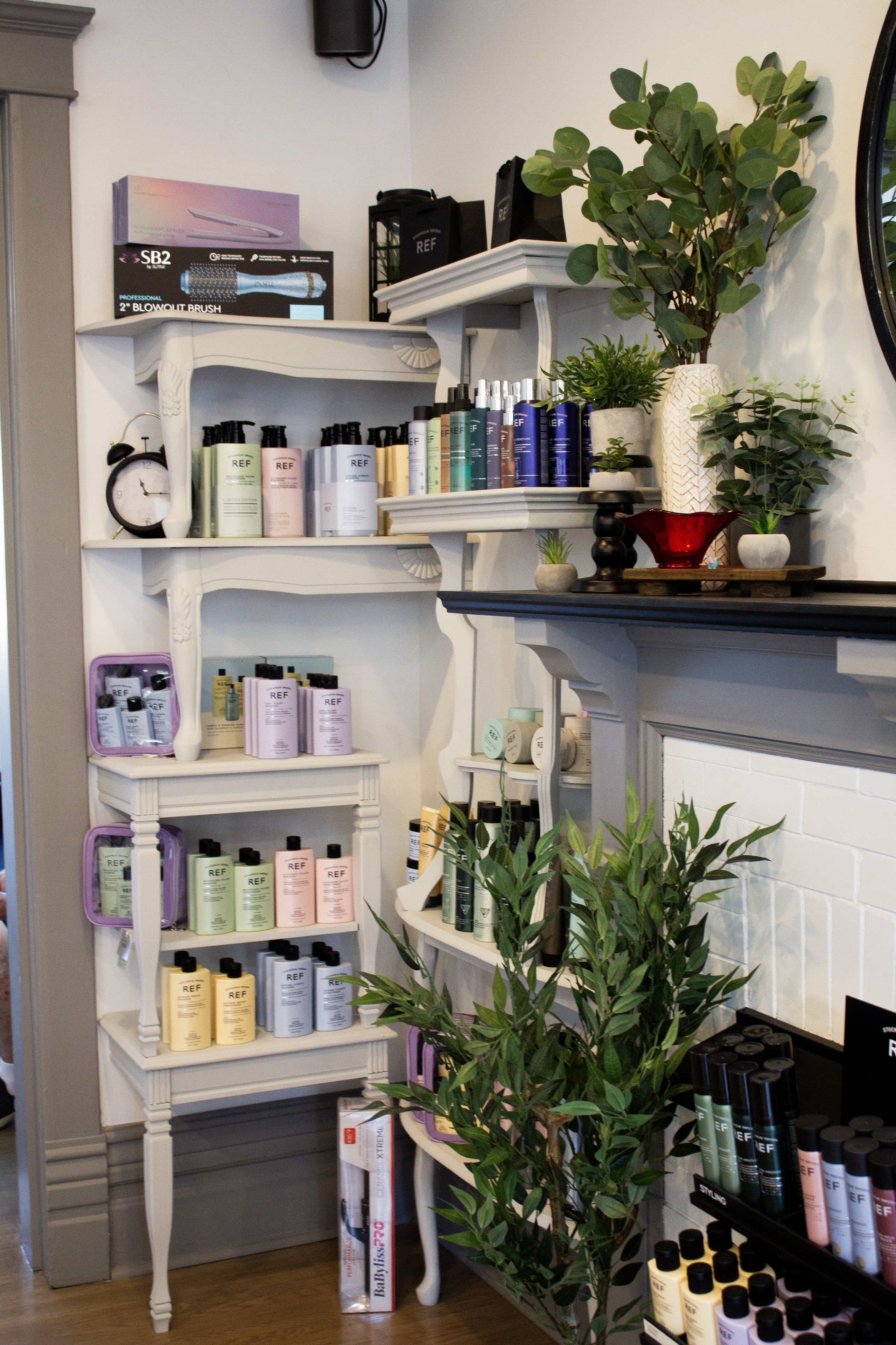 Organized product shelves at Village Hair Co.
